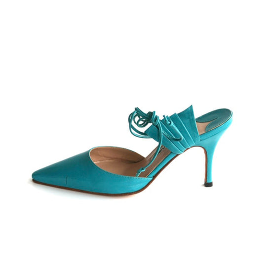 Teal high-heeled shoe on a white background