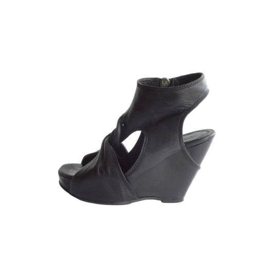 Black wedge sandal on a white background