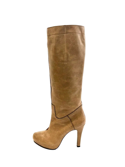 Tan knee-high boot on a white background