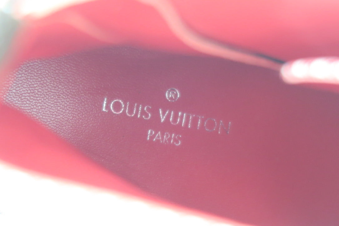Close-up of a Louis Vuitton logo on a red insole