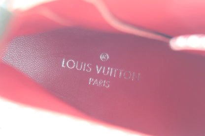 Close-up of a Louis Vuitton logo on a red insole
