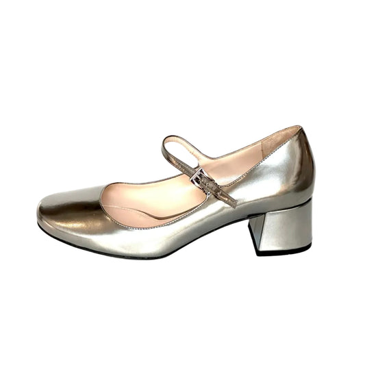 A metallic silver Mary Jane shoe with a block heel, shown from a side profile on a white background.