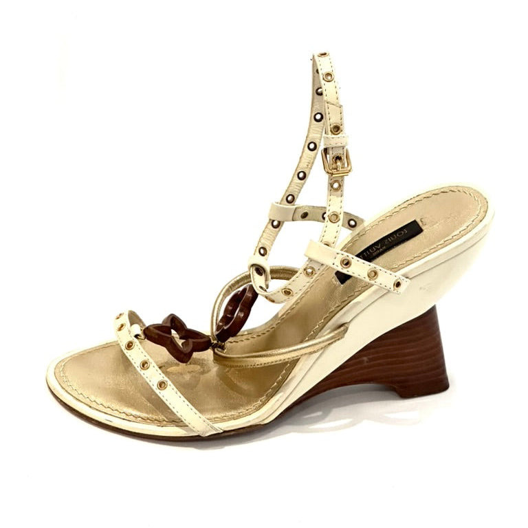 Beige sandal with brown heel on a white background